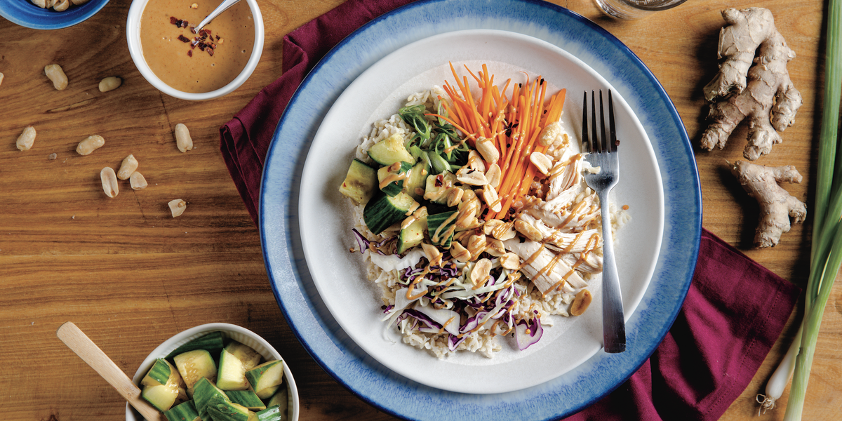 Peanut Chicken Bowl plated on a wooden table