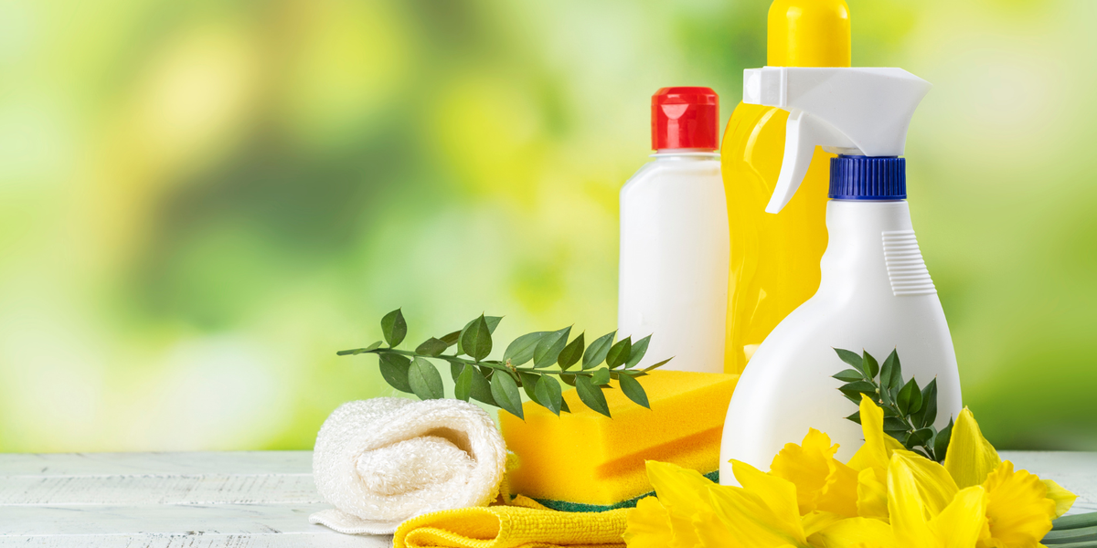 Cleaning supplies against a blurred spring background